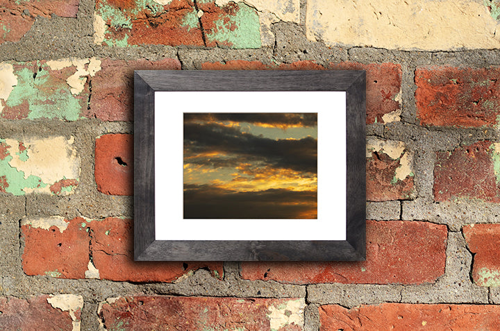 Nature photography print of a glowing autumn sunset mounted with a black frame called Aureola by Loud Hue