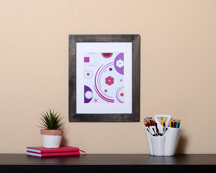 Art Print of a fun pink and purple flowery design shown with a black frame called Jewel by Loud Hue.