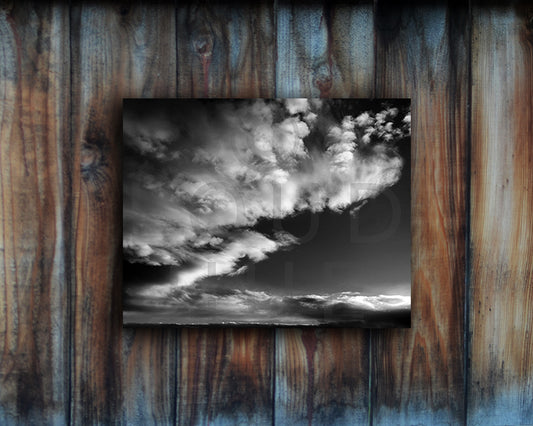 Black and White photographic print of a dramatic sky shown mounted without a frame called Luminous by Loud Hue