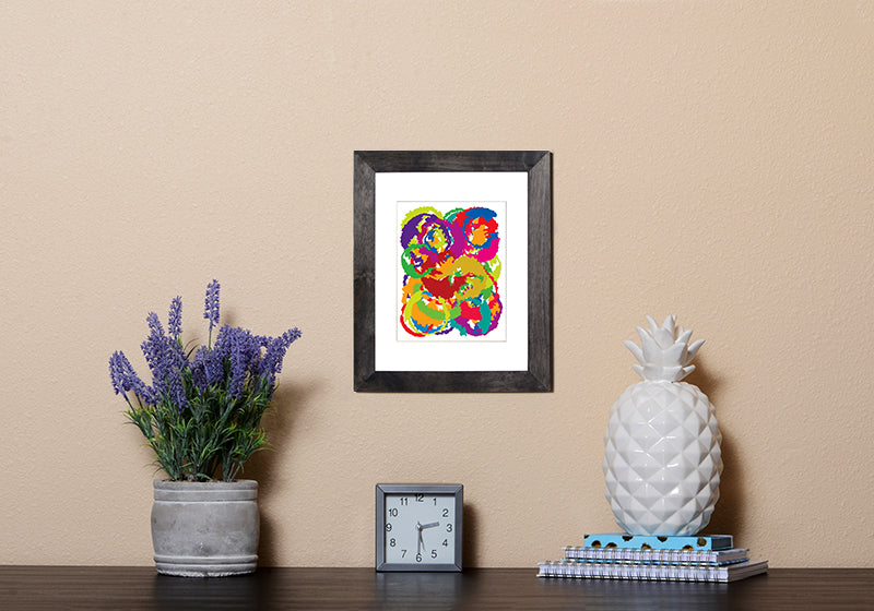 Abstract Art Print resembling the moon in vibrant colors in black frame called Luna by Loud Hue