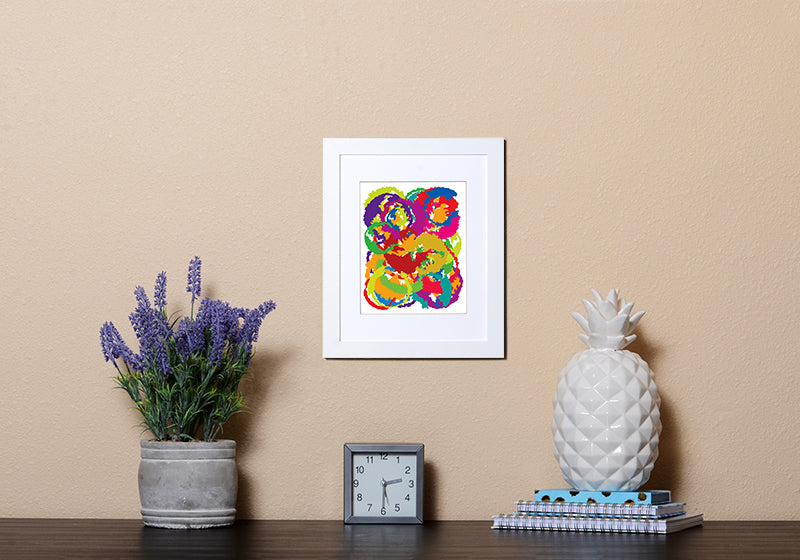 Abstract Art Print resembling the moon in vibrant colors in white frame called Luna by Loud Hue
