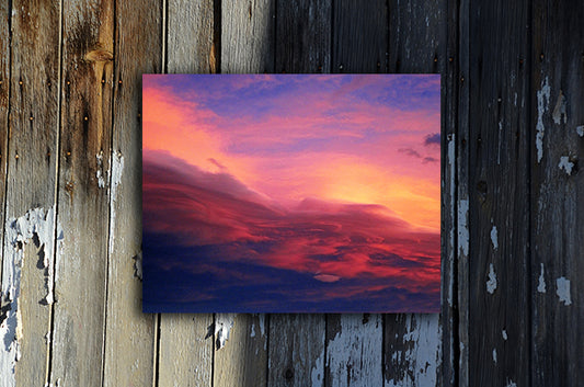Nature photography print of a luminous blue, pink, yellow and red sunset shown mounted without a frame called Purple by Loud Hue