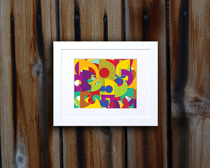 Pop art style Art Print of bold and colorful geometric shapes shown with white frame called Puzzle by loud Hue