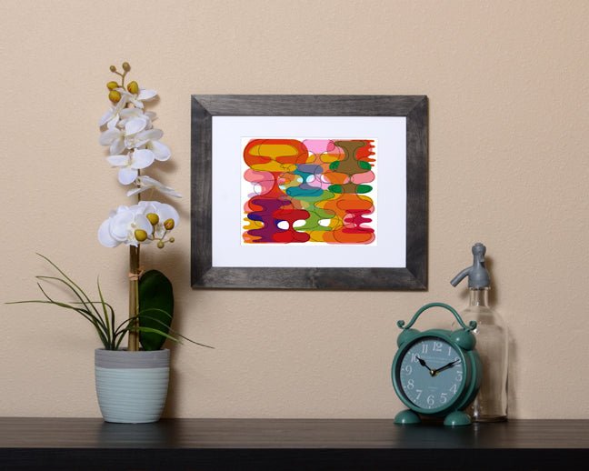 Retro style Art Print of vibrant geometric shapes shown with a black frame called Reflect by Loud Hue