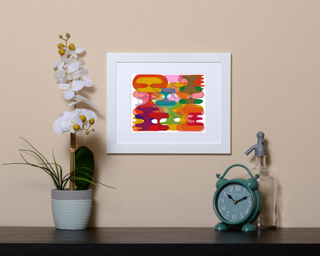 Retro style Art Print of vibrant geometric shapes shown with a white frame called Reflect by Loud Hue