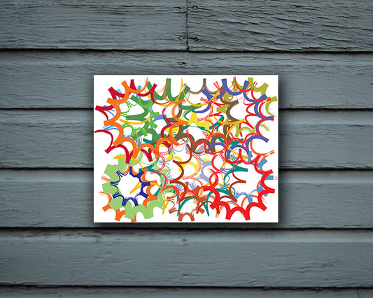 Fun Art Print with overlapping shapes resembling sprockets and wheels shown mounted on a wall called Wheels by Loud Hue