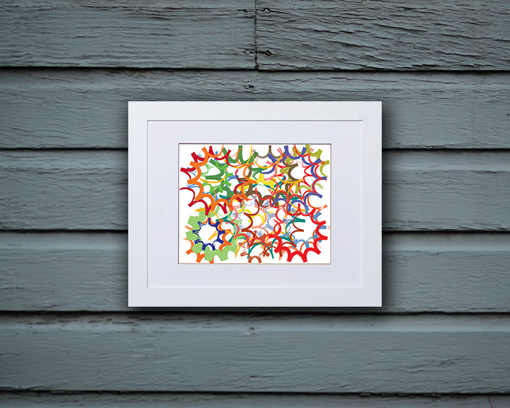 Fun Art Print with overlapping shapes resembling sprockets and wheels shown with a white frame called Wheels by Loud Hue
