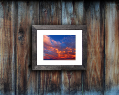 Nature photography print of a bright and peaceful sunset shown mounted with a black frame called Balance by Loud Hue