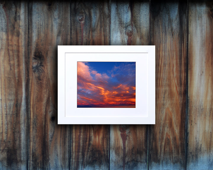 Nature photography print of a bright and peaceful sunset shown mounted with a white frame called Balance by Loud Hue