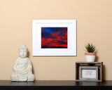 Nature photography print of a glowing red sunset with a white frame called Cotton Candy by Loud Hue