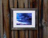 Beautiful nature photo of a blue, white and purple sky with black frame called Depth by Loud Hue