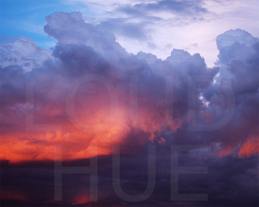 Nature photography print of a turbulent multicolor sunset called Divine by Loud Hue
