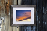 Photographic print of a celestial sunset with blue and yellow tones called Heavenly Glow by Loud Hue