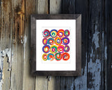 Art Print of energetic and colorful circles with a brushstroke effect shown mounted with a black frame called Jolt by Loud Hue