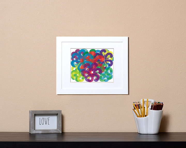 Art Print of overlapping flowers in cheerful bright colors shown in a white frame called Spring by Loud Hue