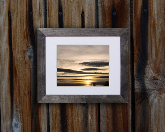Nature photography print of a peaceful and serene winter sunset shown with a black frame called Flawless by Loud Hue