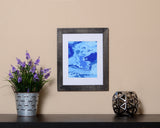 Vibrant abstract Art Print in the form of waves with hues of blues with black frame called Boundless by Loud Hue