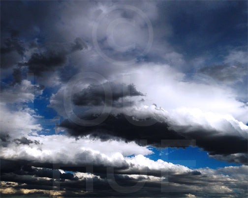 Nature photography print of a dramatic blue, gray and black cloudy sky called Cotton by Loud Hue