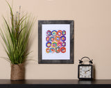 Modern colorful abstract Art Print with circle designs and brushstrokes effect called Jolt with black frame by Loud Hue