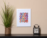 Modern colorful abstract Art Print with circle designs and brushstrokes effect called Jolt with white frame by Loud Hue